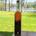 homemade pure vanilla extract in a bottle with natural background