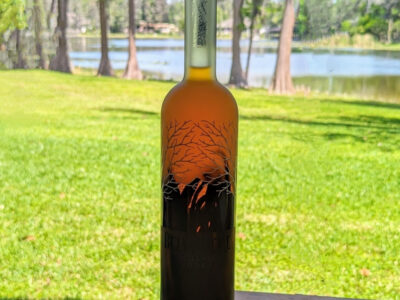 homemade pure vanilla extract in a bottle with natural background