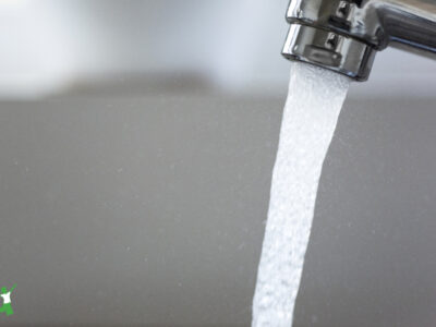 fluoridated water running from kitchen faucet