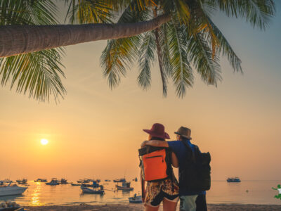 traveling couple on vacation taking important supplements to stay healthy
