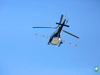 helicopter spraying insecticides for mosquitoes