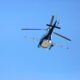 helicopter spraying insecticides for mosquitoes