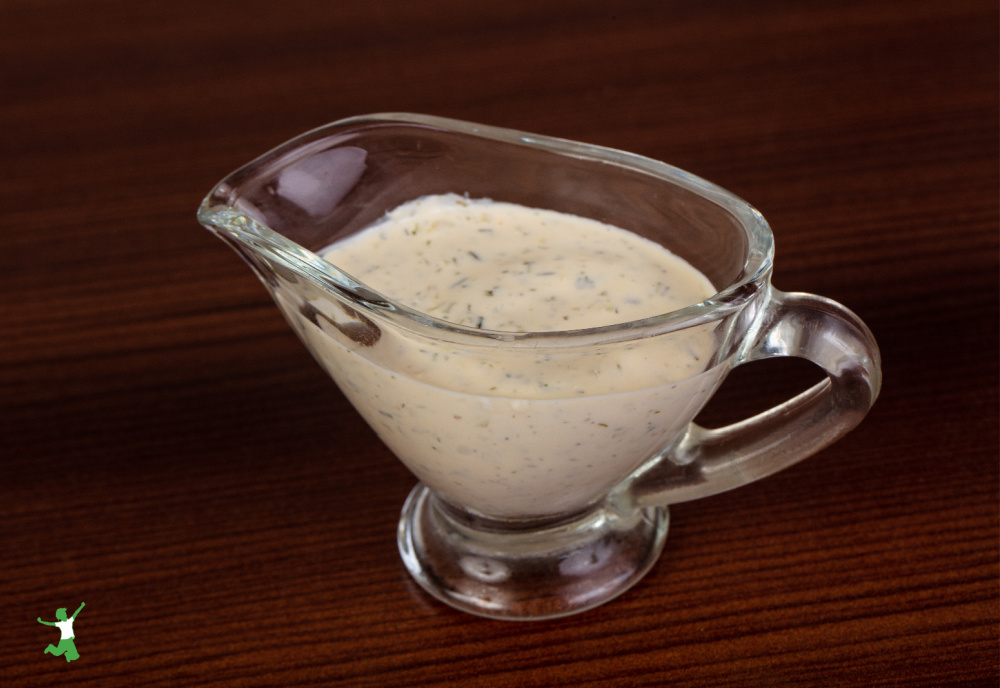 fermented tartar sauce in glass dish on wood table