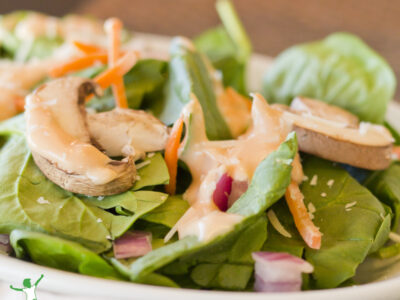 homemade thousand island dressing on healthy salad mix