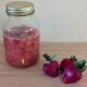 cultured strawberry sauce in glass jar