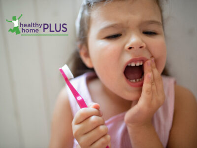 young girl with cavity in a baby tooth