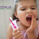 young girl with cavity in a baby tooth