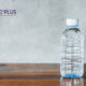 flouride contaminated bottled water on wooden table