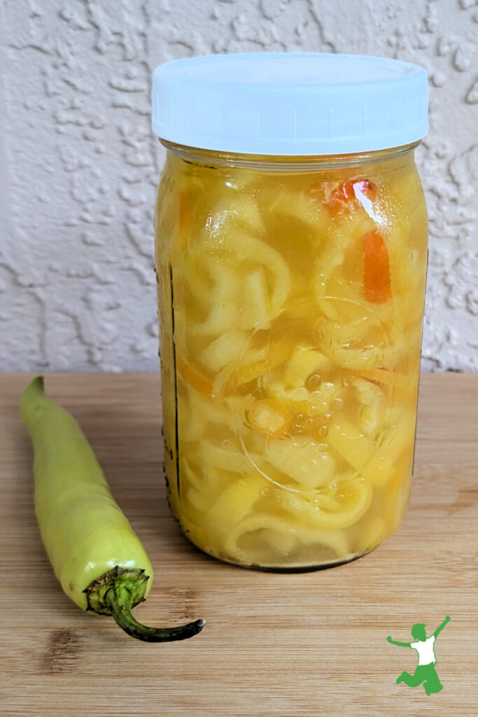 fermented banana pepper rings in glass jar