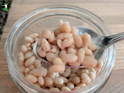 white natto in glass jar with spoon