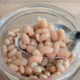 white natto in glass jar with spoon
